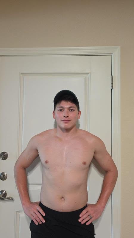 Coaching client photographed from the front: 2 months
